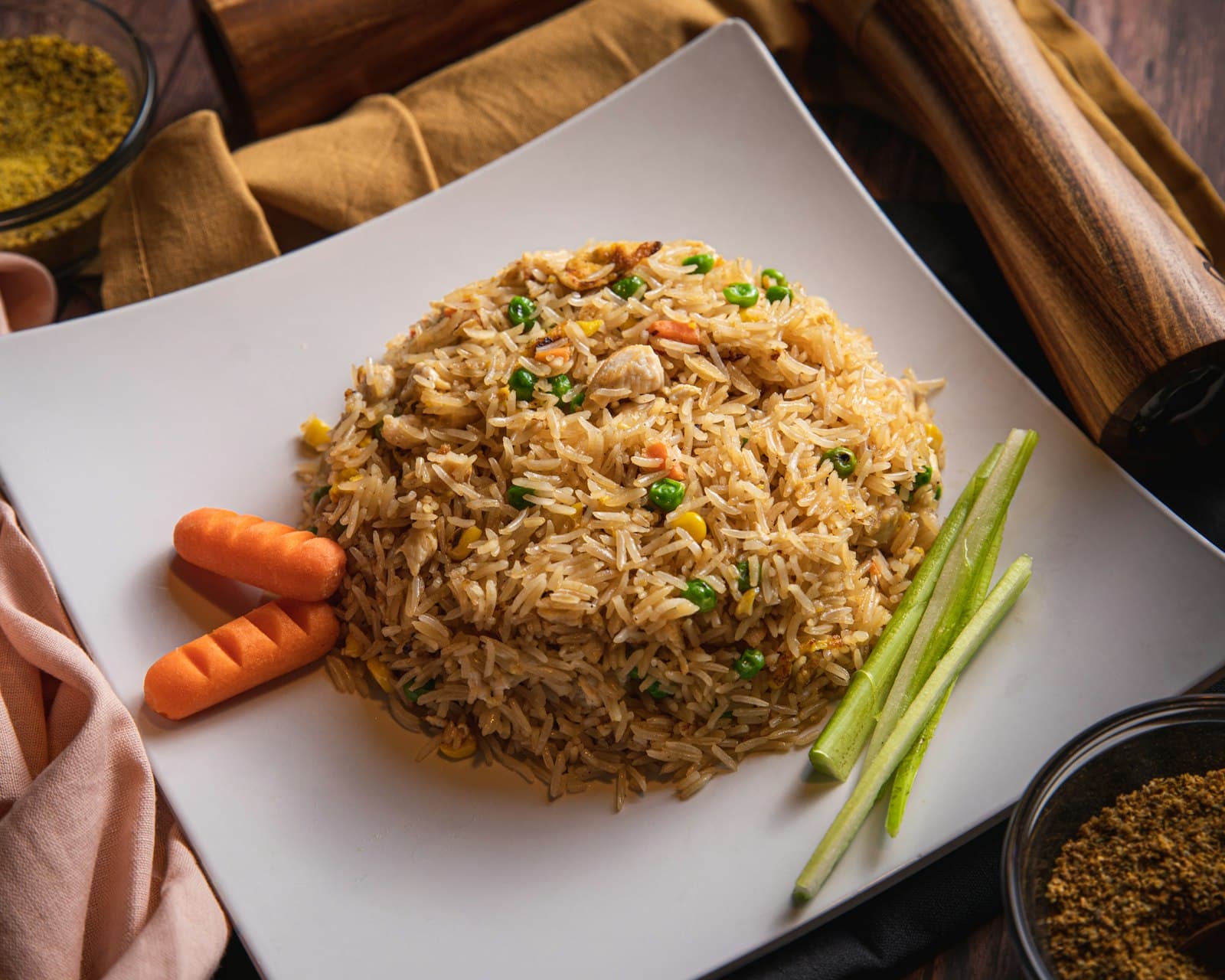 A bowl of seasoned chicken over rice with black beans